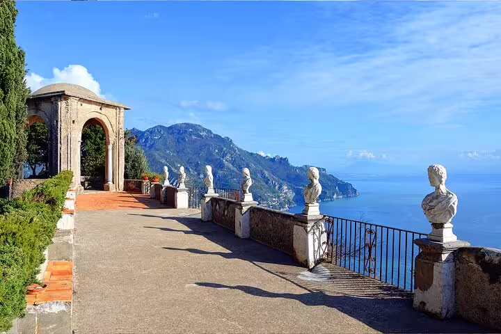 Ravello terrace with marble busts and archway overlooking Amalfi Coast, VIP small group scenic stop