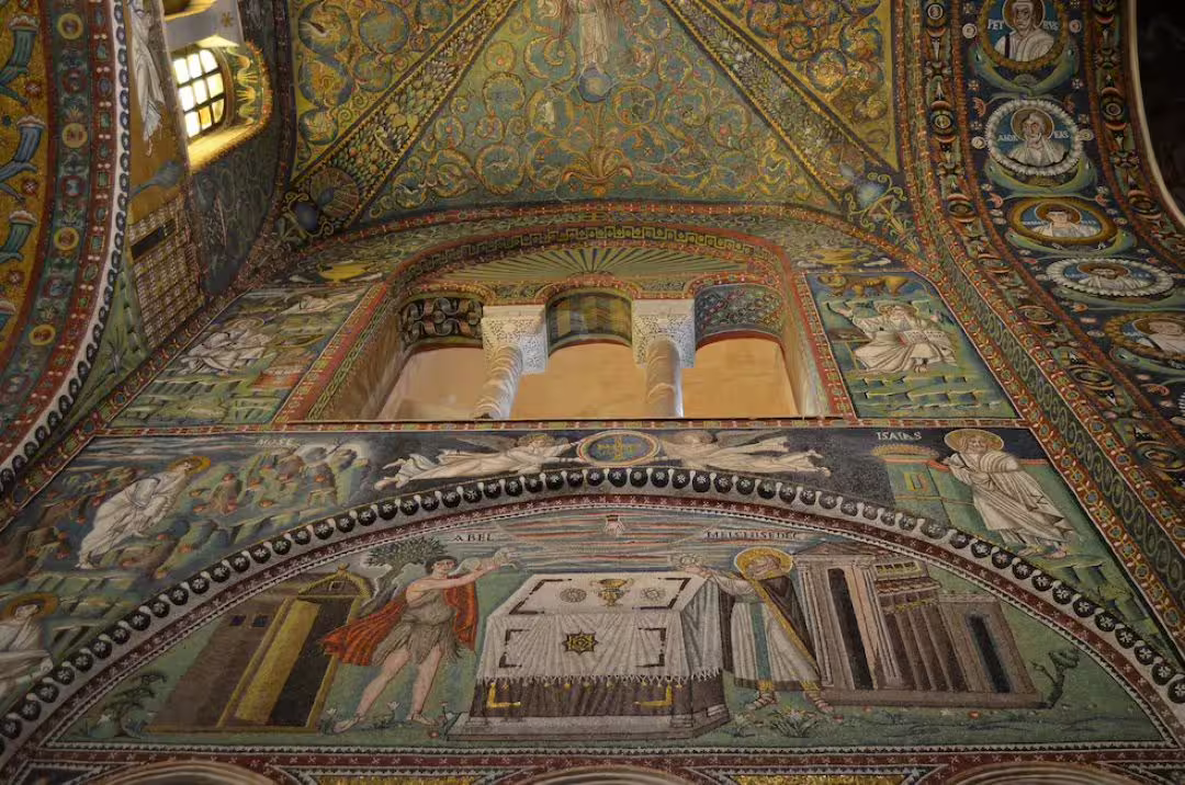 Close-up of Ravenna basilica interior with glittering Byzantine mosaics and saints, visited on a private walking tour