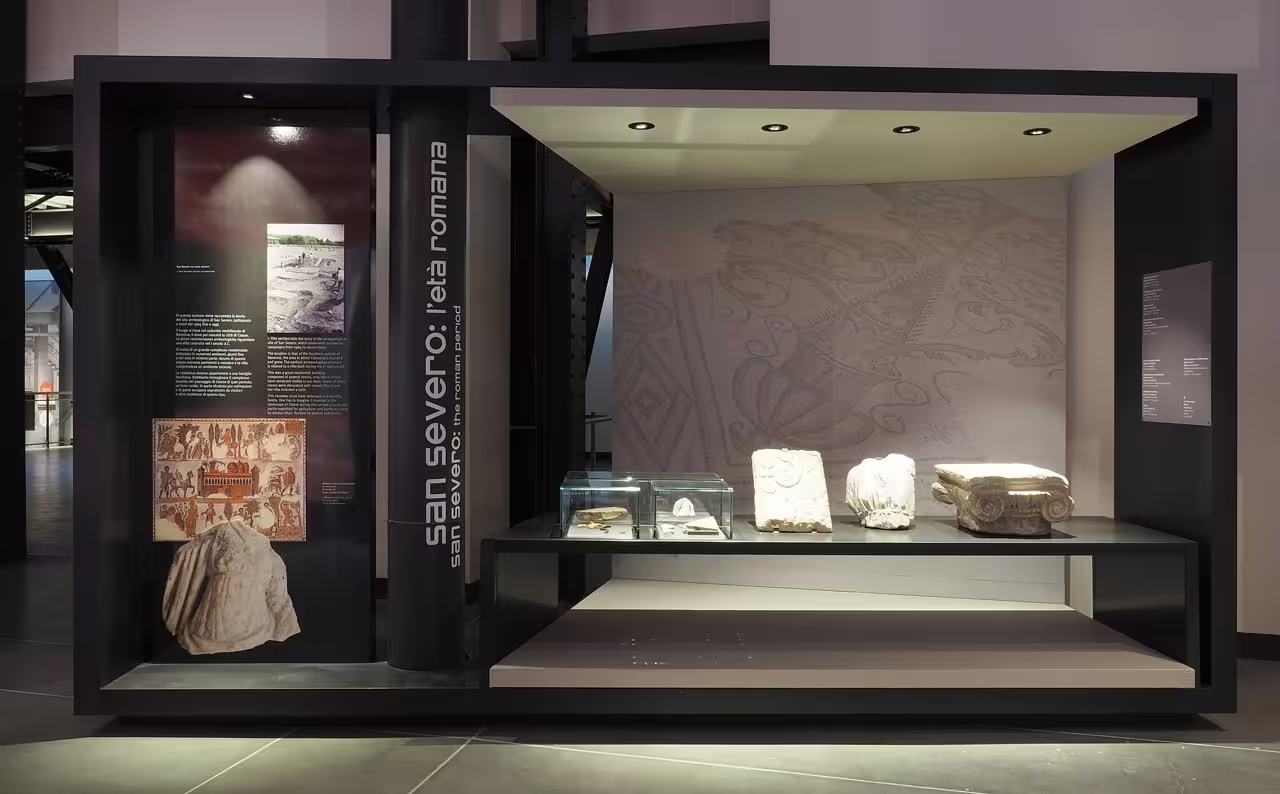San Severo Roman-era exhibit cases and stone fragments inside Ravenna Classis Museum, included with entry ticket