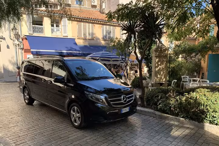 Comfortable van on a charming street, ideal for transfer from Ravenna Cruise Terminal to Bologna Airport.