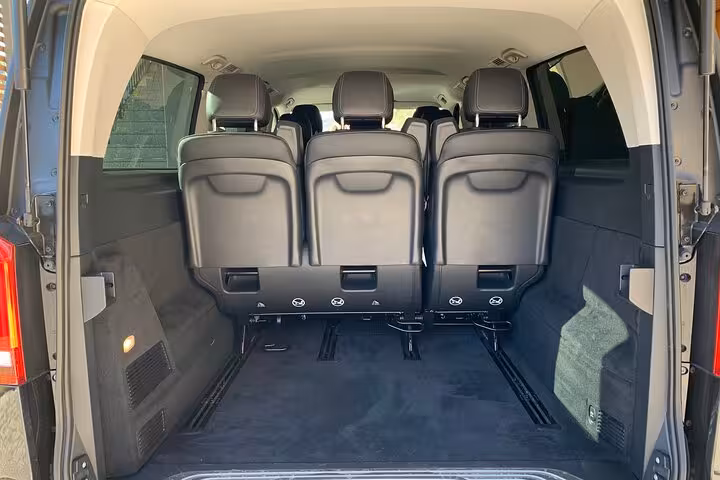 Spacious interior of a modern van for transfer from Ravenna Cruise Terminal to Bologna Airport.