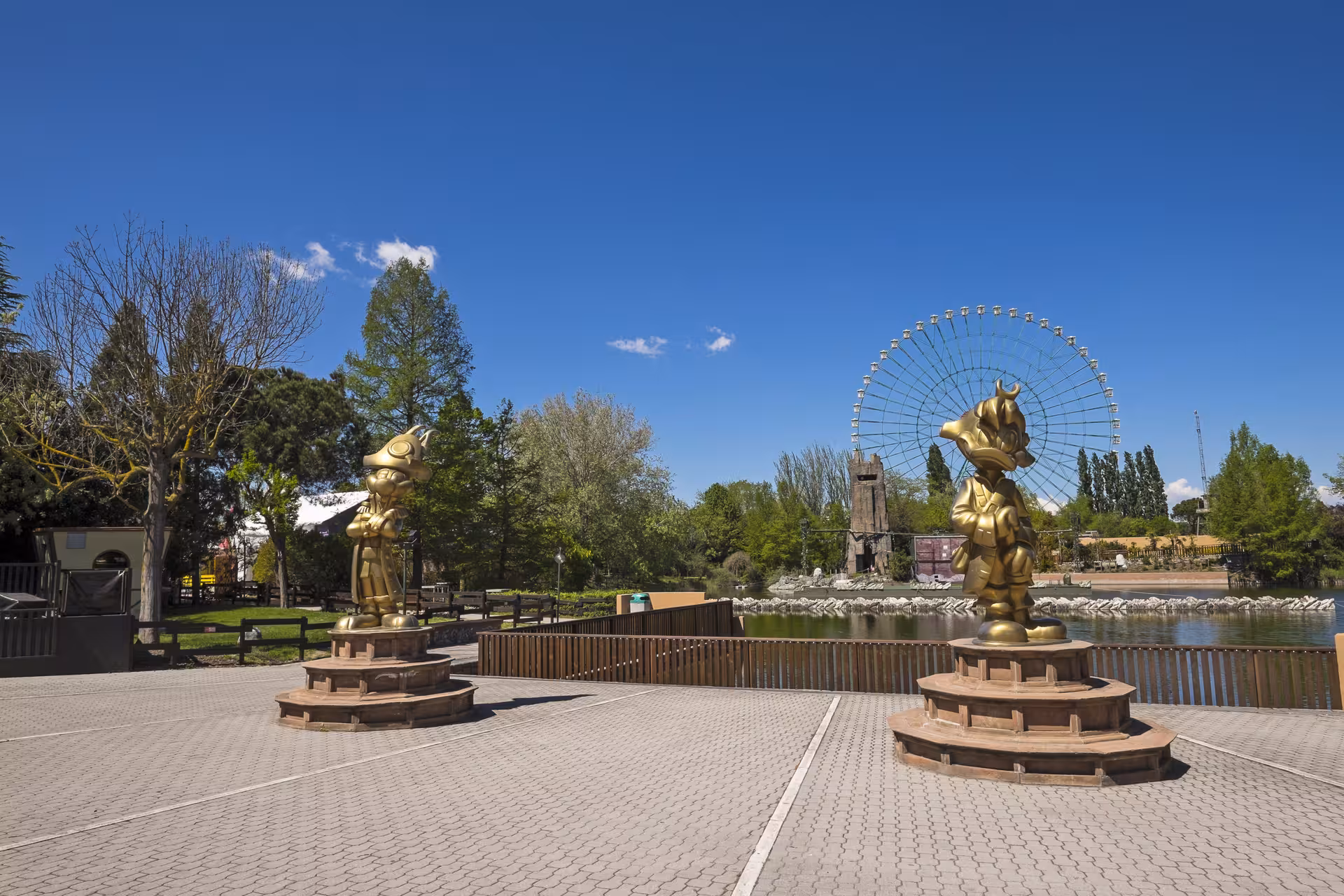 Mirabilandia entrance plaza in Ravenna with golden statues and giant ferris wheel, combo ticket experience