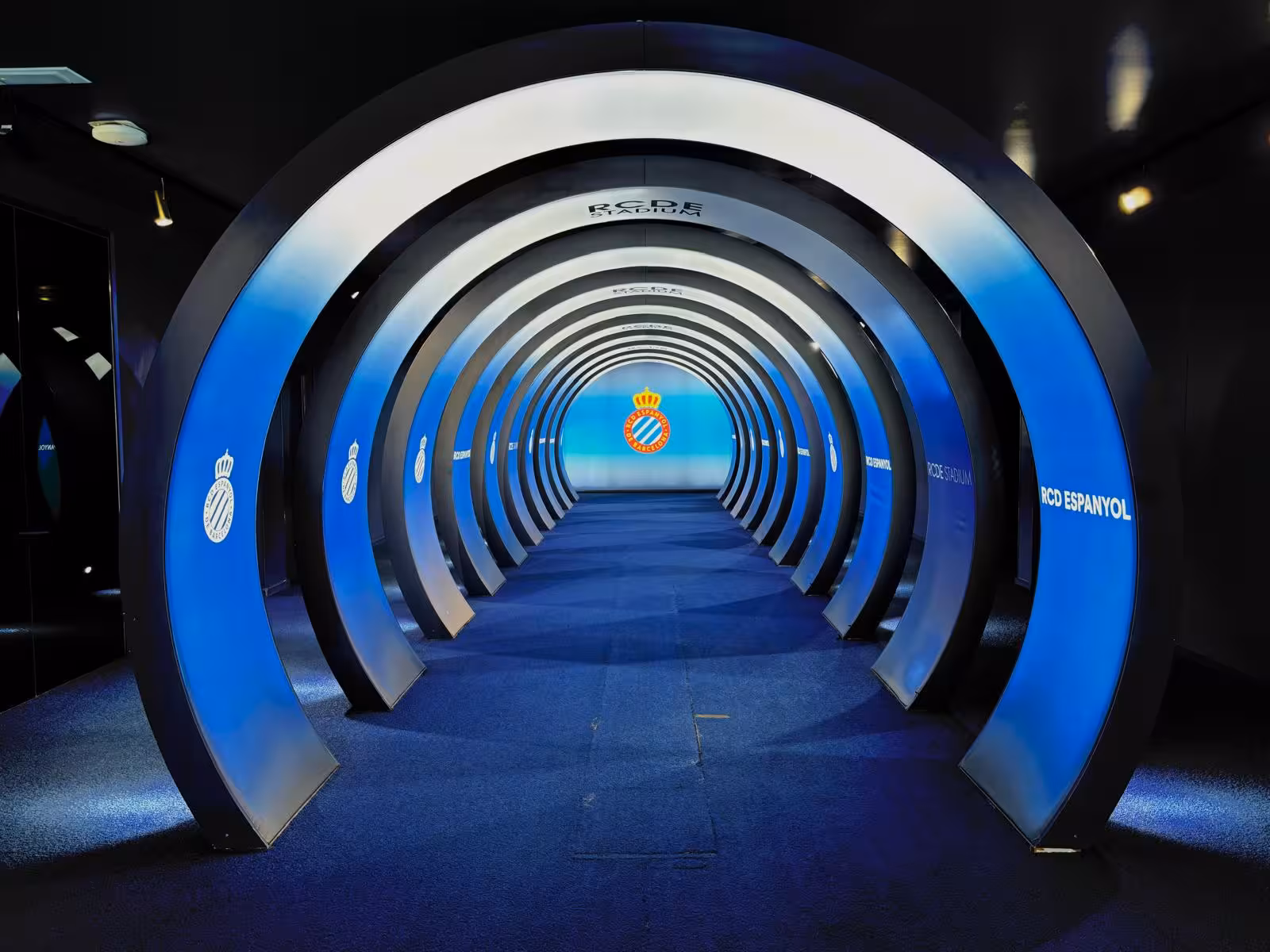 RCD Espanyol stadium tunnel with blue arches, included stop on Barcelona all-inclusive football tour itinerary