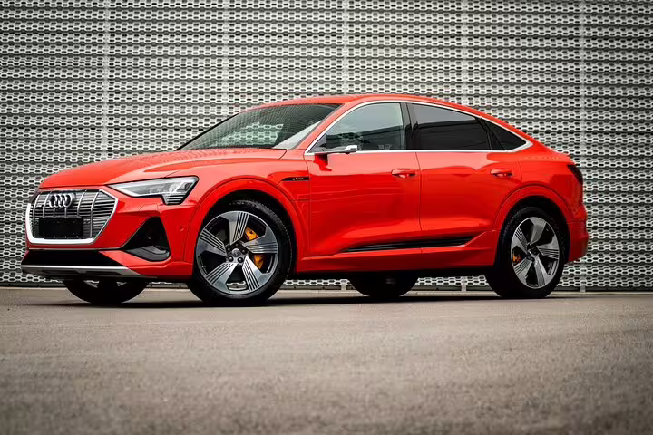 Red Audi e-tron SUV luxury transfer vehicle for Milan Malpensa Airport