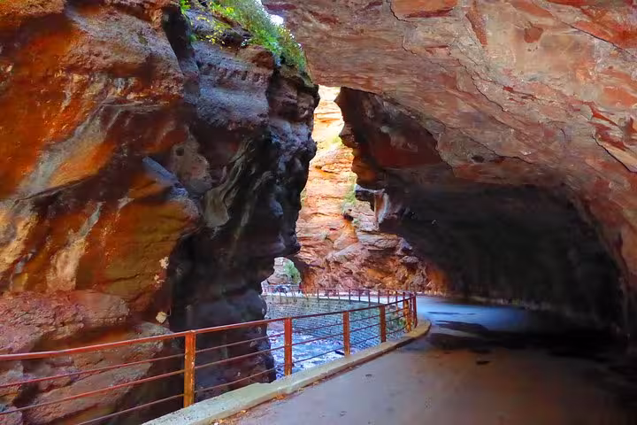 Scenic view of the stunning red rock formations in a canyon tunnel on the Fabulous Red Canyon tour near Entrevaux.