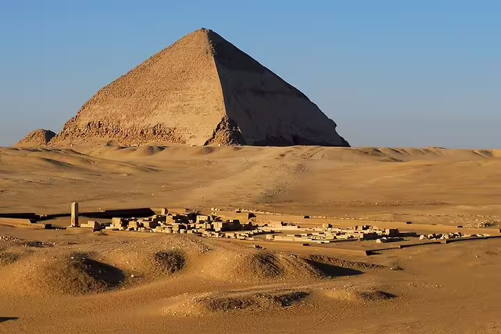 Red Pyramid of Dahshur rising over desert ruins, key stop on Dahshur Pyramid and Memphis City private tour