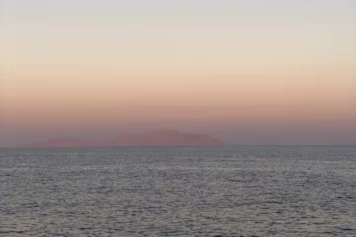 Red Sea sunset over Hamata Islands, Marsa Alam, scenic boat trip view for snorkeling excursion in Egypt