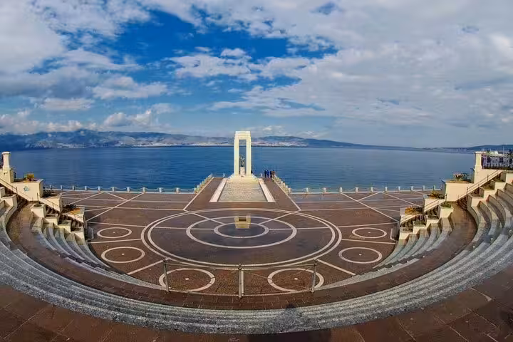 Panoramic view of Reggio Calabria seafront amphitheater and Vittorio Emanuele III monument overlooking the Strait of Messina