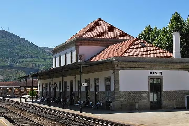 Historic Régua train station nestled in the picturesque Douro Valley, a gateway for scenic boat tours.