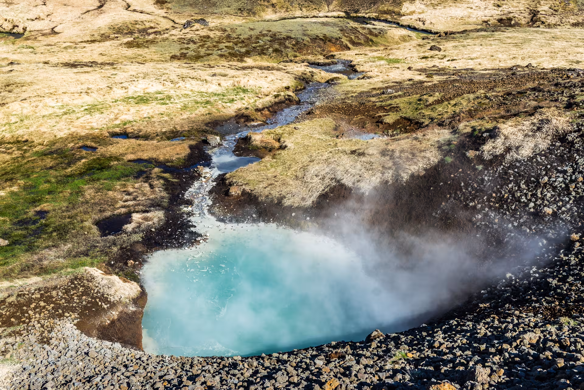 Turquoise geothermal hot spring with steam in Grændalur Valley on Private Reykjadalur & Grændalur circle hike