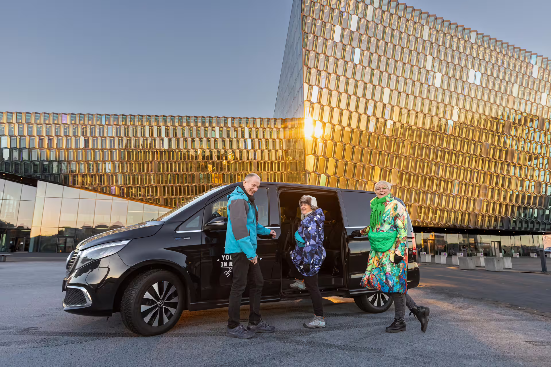 Travellers entering a tour vehicle from Your Friend in Reykjavik 