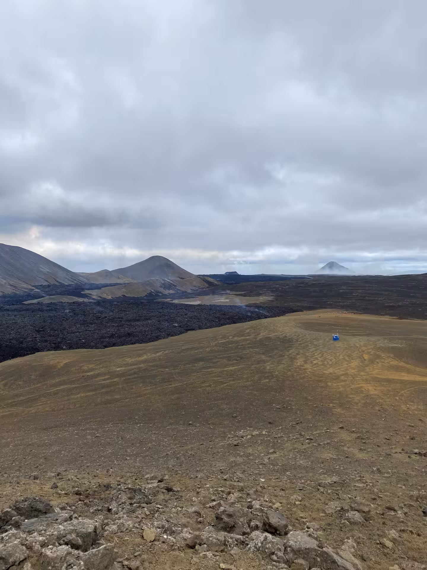 Vast volcanic lava fields and volcanic cones on the Reykjanes Peninsula under cloudy skies