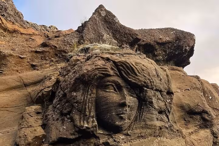 Rock face carving embedded in volcanic cliffs on the Reykjanes Peninsula, Iceland