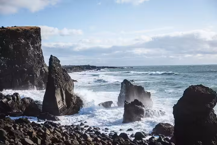 Rocky coastal cliffs with crashing waves on the Reykjanes Peninsula, Iceland