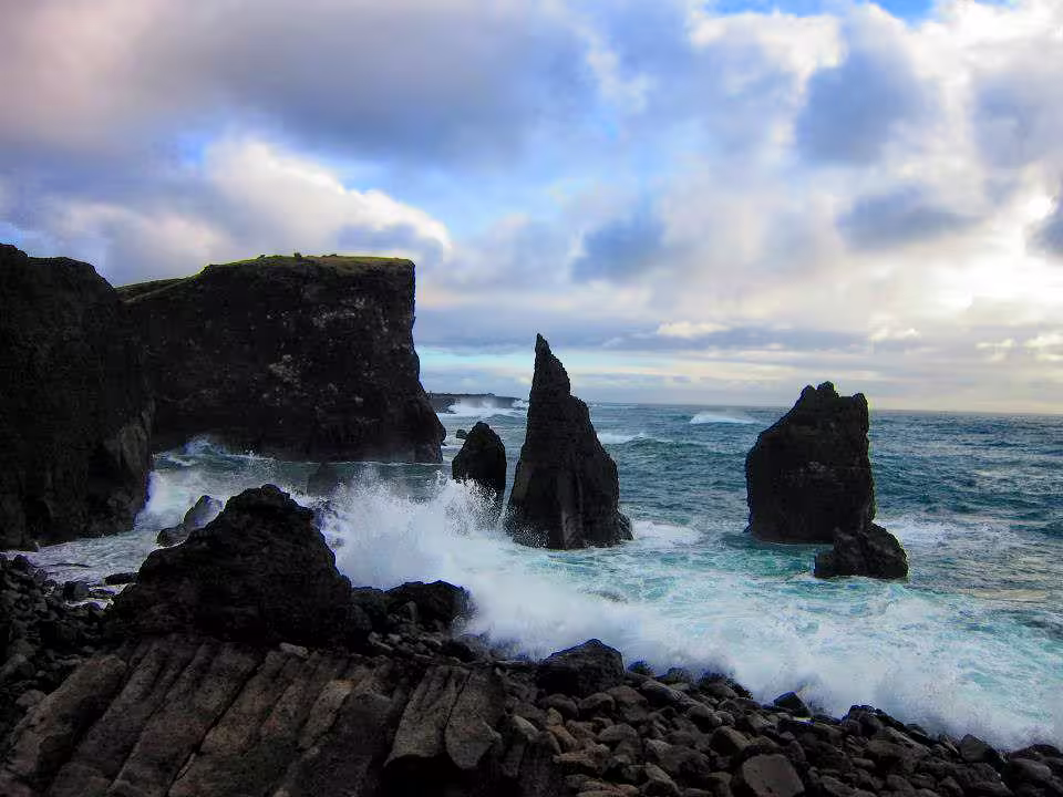 Dramatic volcanic sea stacks and crashing waves on the rugged Reykjanes Peninsula coastline, Iceland