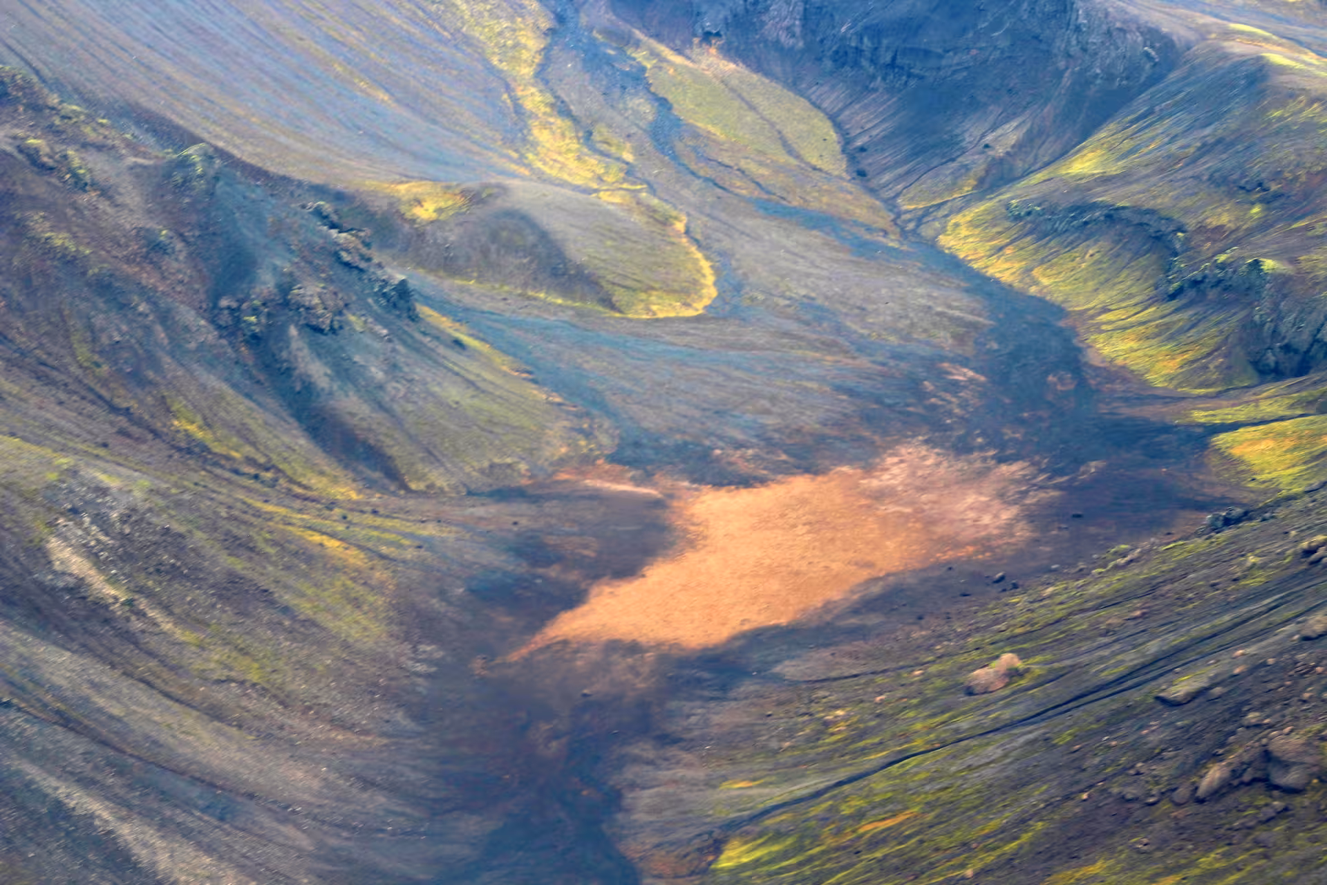 Aerial view of colorful volcanic crater with moss-covered lava fields on Reykjanes Peninsula, Iceland