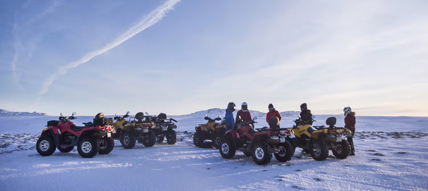 Group of people on ATVs exploring snowy landscapes near Reykjavik during a thrilling 1-hour peak adventure tour.