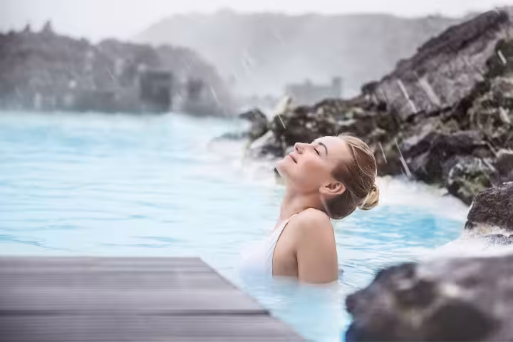 Relaxing in Iceland’s Blue Lagoon geothermal spa, popular Reykjavik to Blue Lagoon transfer tour experience
