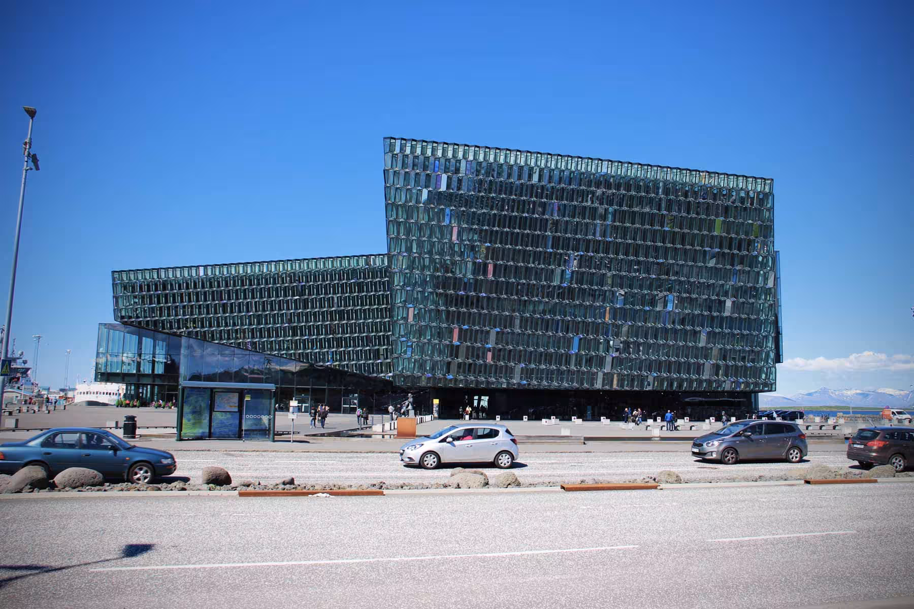 Modern architectural design of Harpa Concert Hall in Reykjavík, a key highlight for city tour travelers.