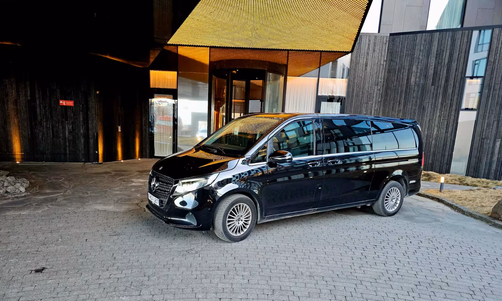 Premium black Mercedes V-Class luxury MPV ready for private transfer from Reykjavik hotel to Keflavik Airport Iceland.