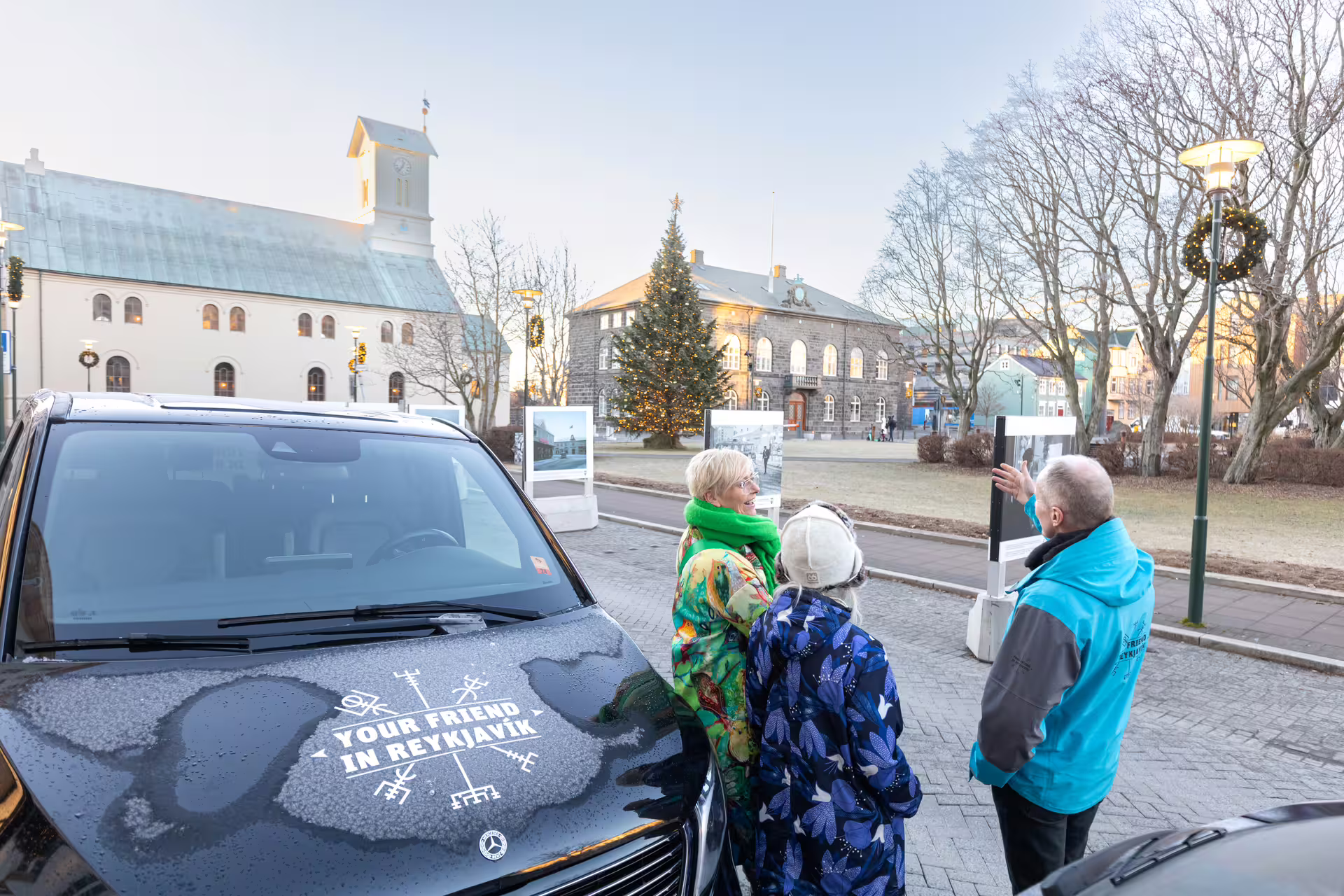 A group of travellers listening to a story shared by the Guide from Your Friend in Reykjavik