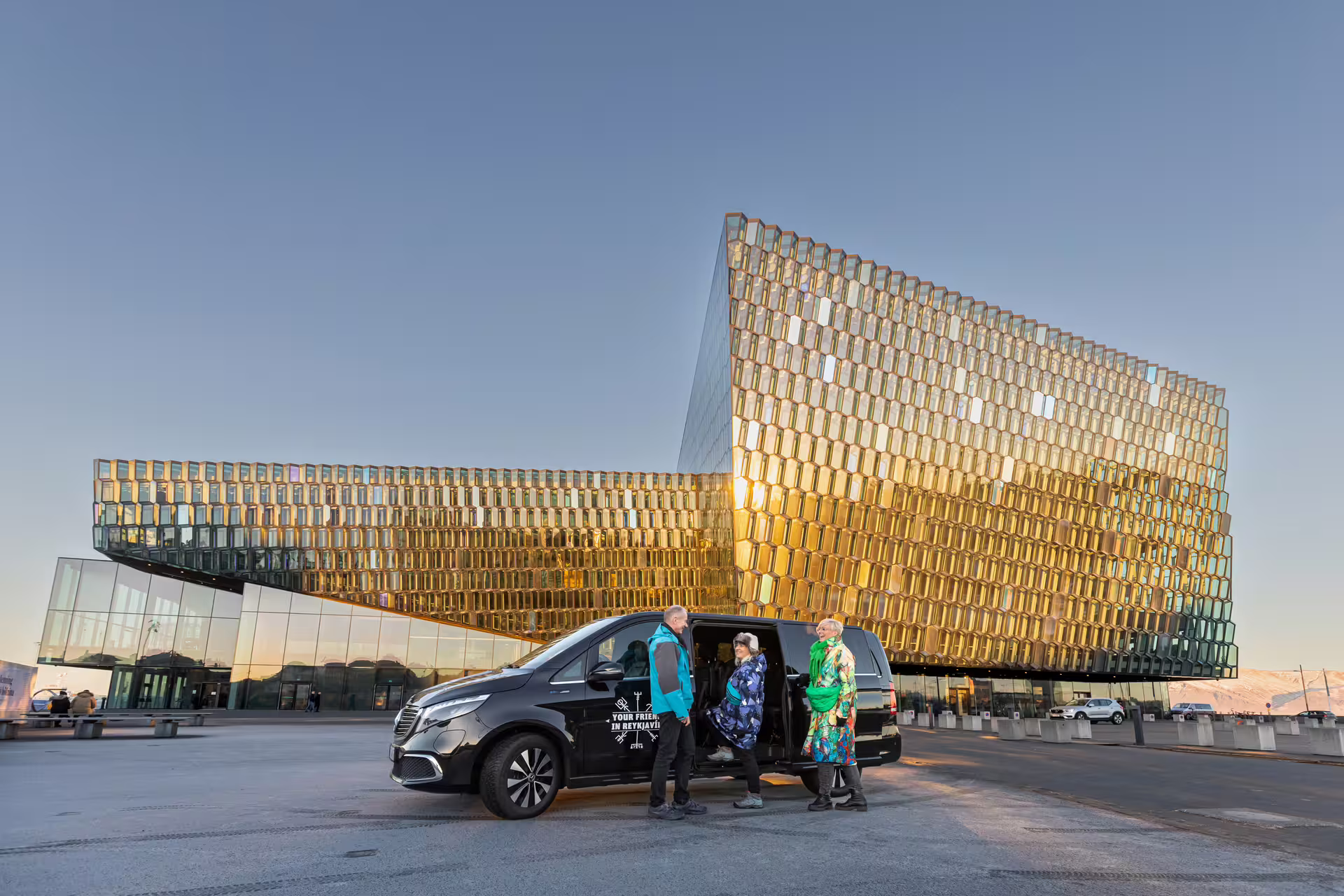Group of travellers meeting the Guide from Your Friend in Reykjavik in front of the Harpa Concert Hall