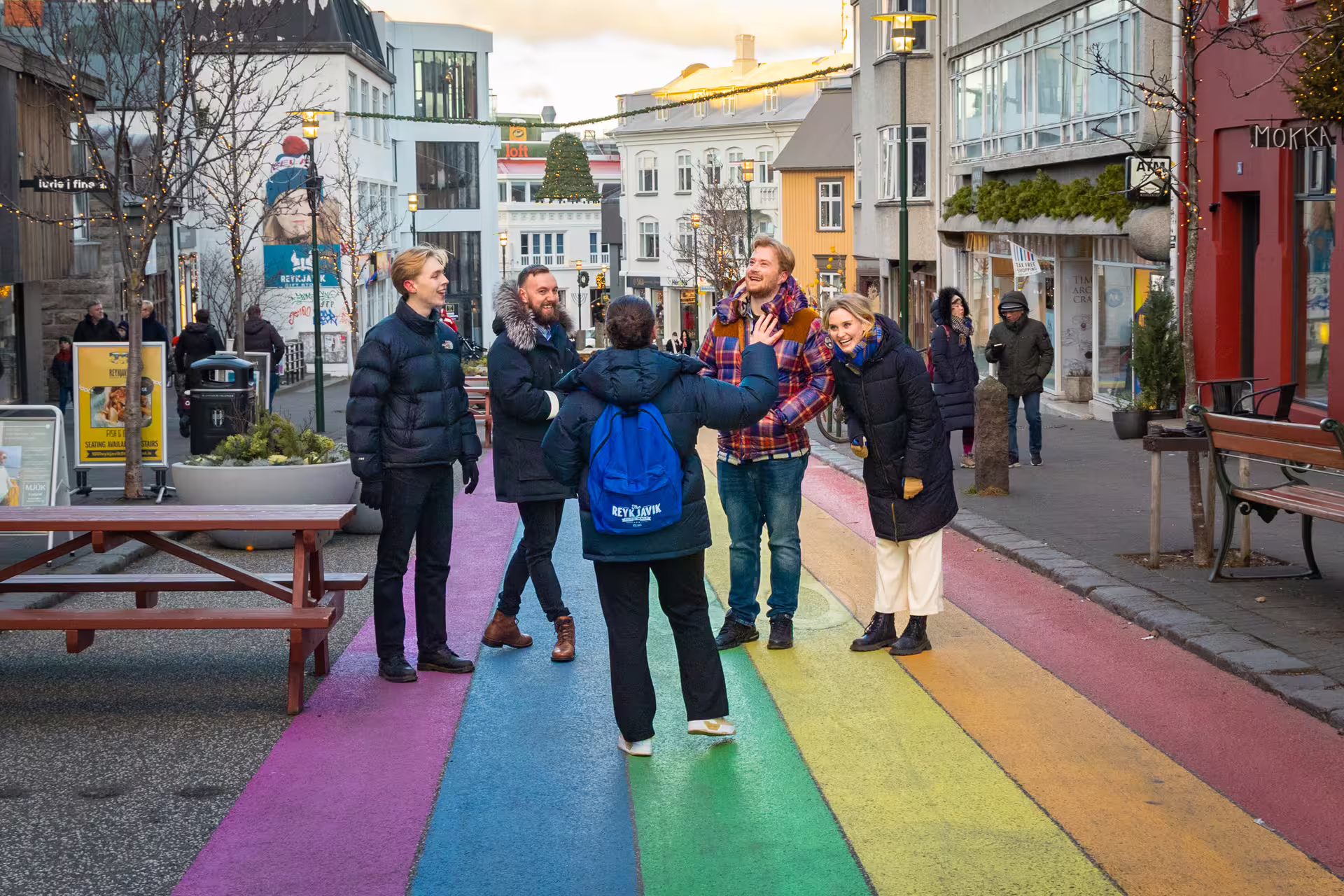Group of tourists on Reykjavik's rainbow street pedestrian area during a walking food tour