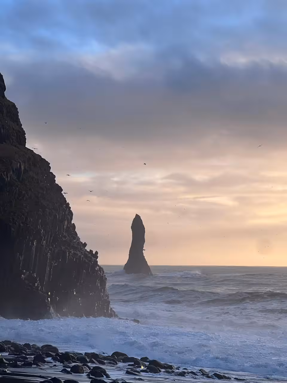 Reynisdrangar sea stack at Reynisfjara beach at sunset on South Coast private tour from Reykjavik, Iceland