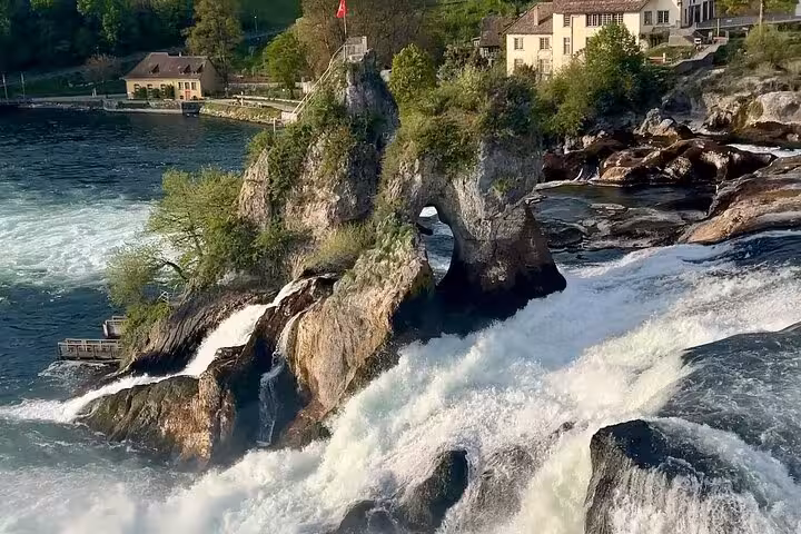 Rhine Falls with rocky island and castle views, scenic stop on a half day luxury tour from Zurich, Switzerland