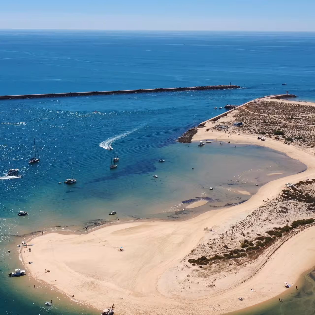 Panoramic view of Ria Formosa barrier island beach and lagoon inlet, a highlight of the 3-island full-day tour