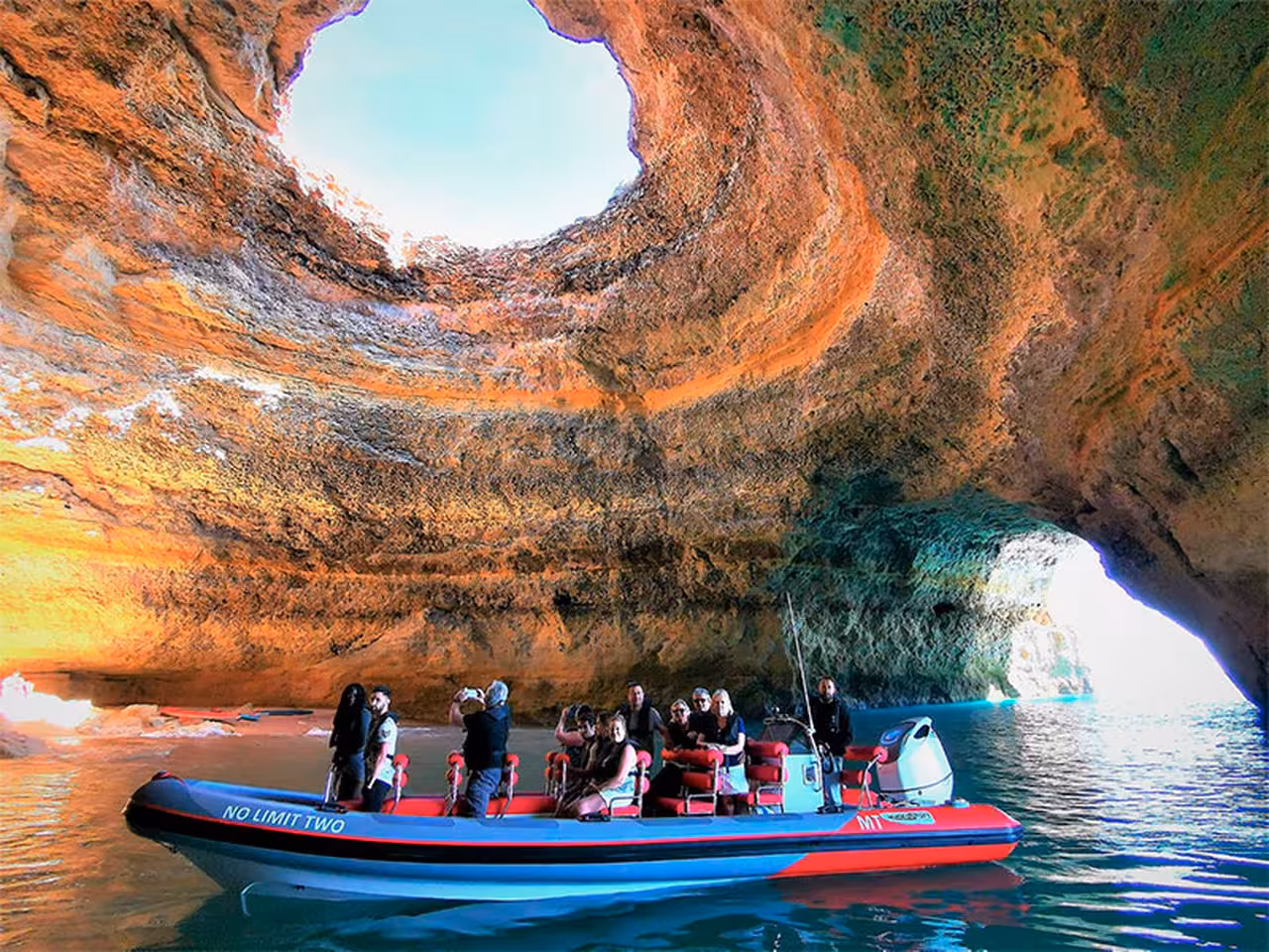 RIB boat inside Benagil Sea Cave from Albufeira Marina, Algarve, sightseeing on caves and dolphin watching tour