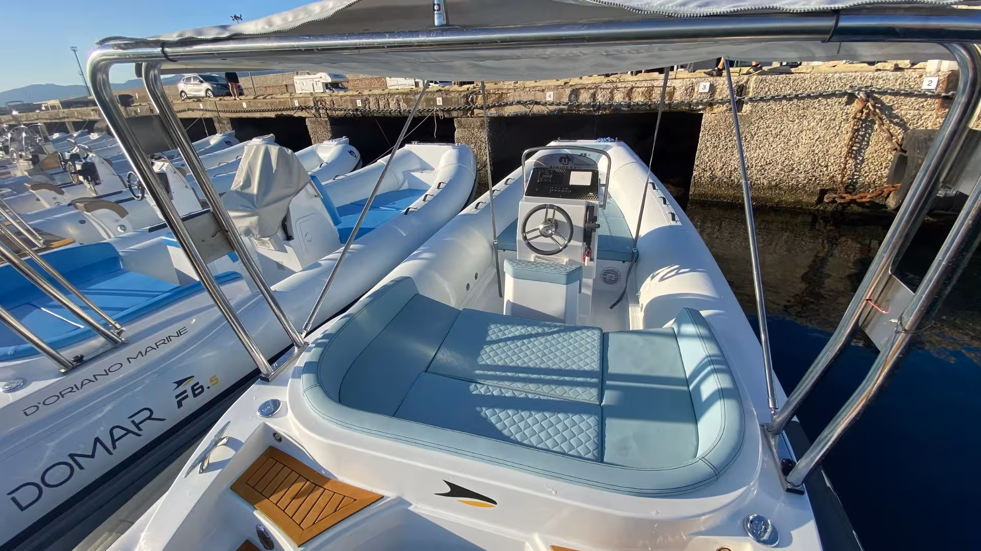 Interior view of a comfortable RIB boat with padded seating, perfect for Sardinia's coastal explorations.