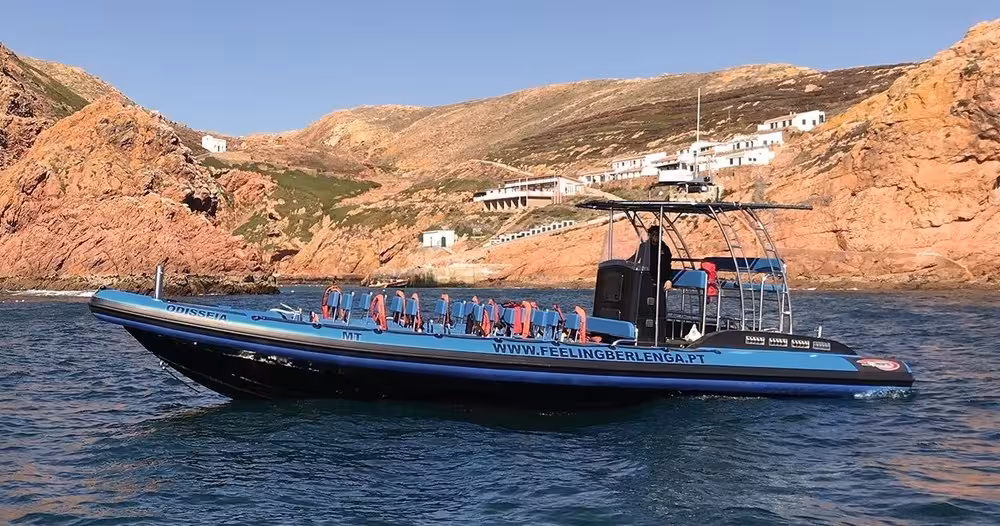 RIB speedboat for Berlengas Islands Premium Pack tour cruising past rocky coastline near Peniche, Portugal