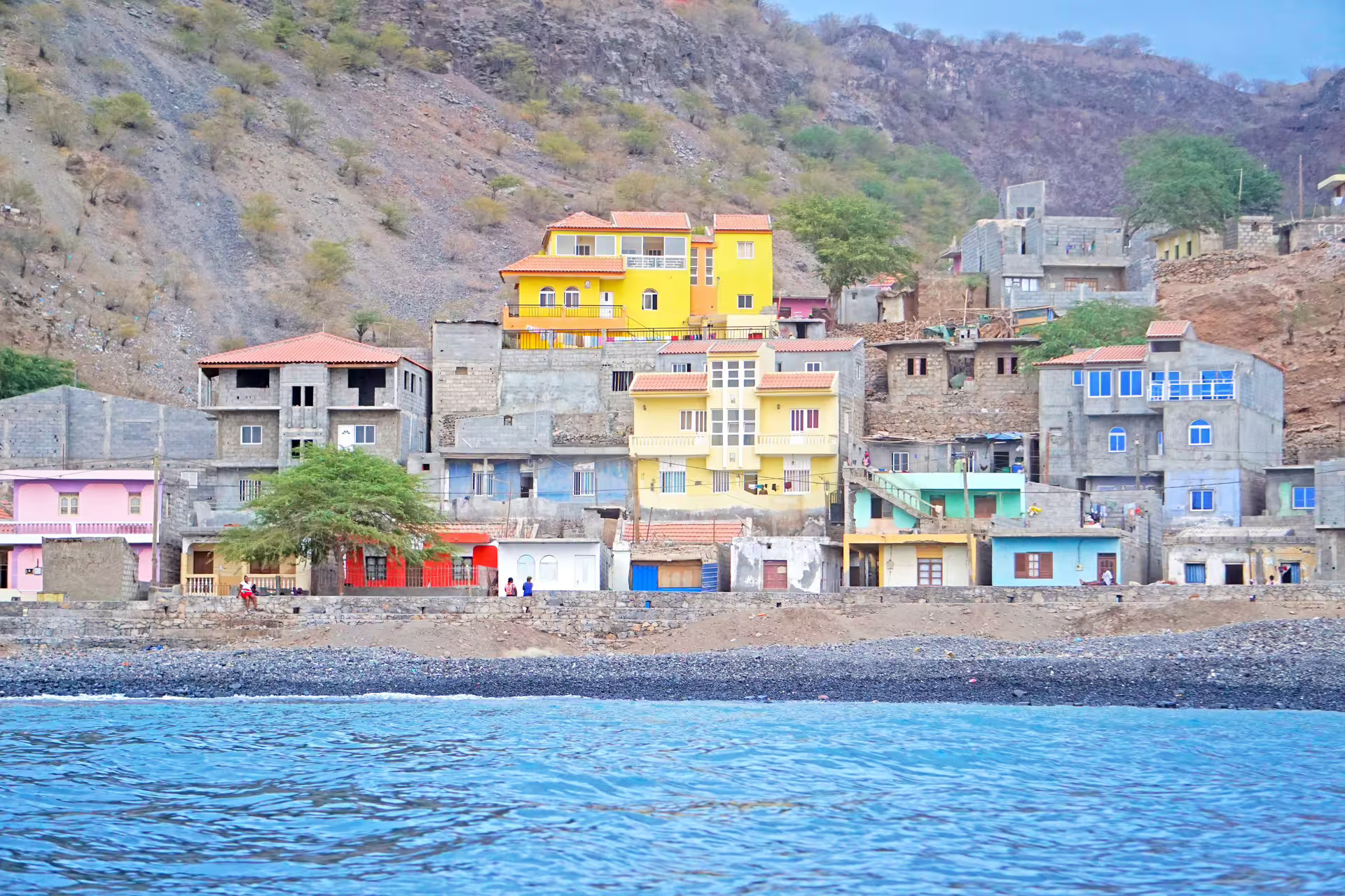 Ribeira da Barca coastline with colorful hillside homes seen from boat, Cape Verde cave tour and beach BBQ trip