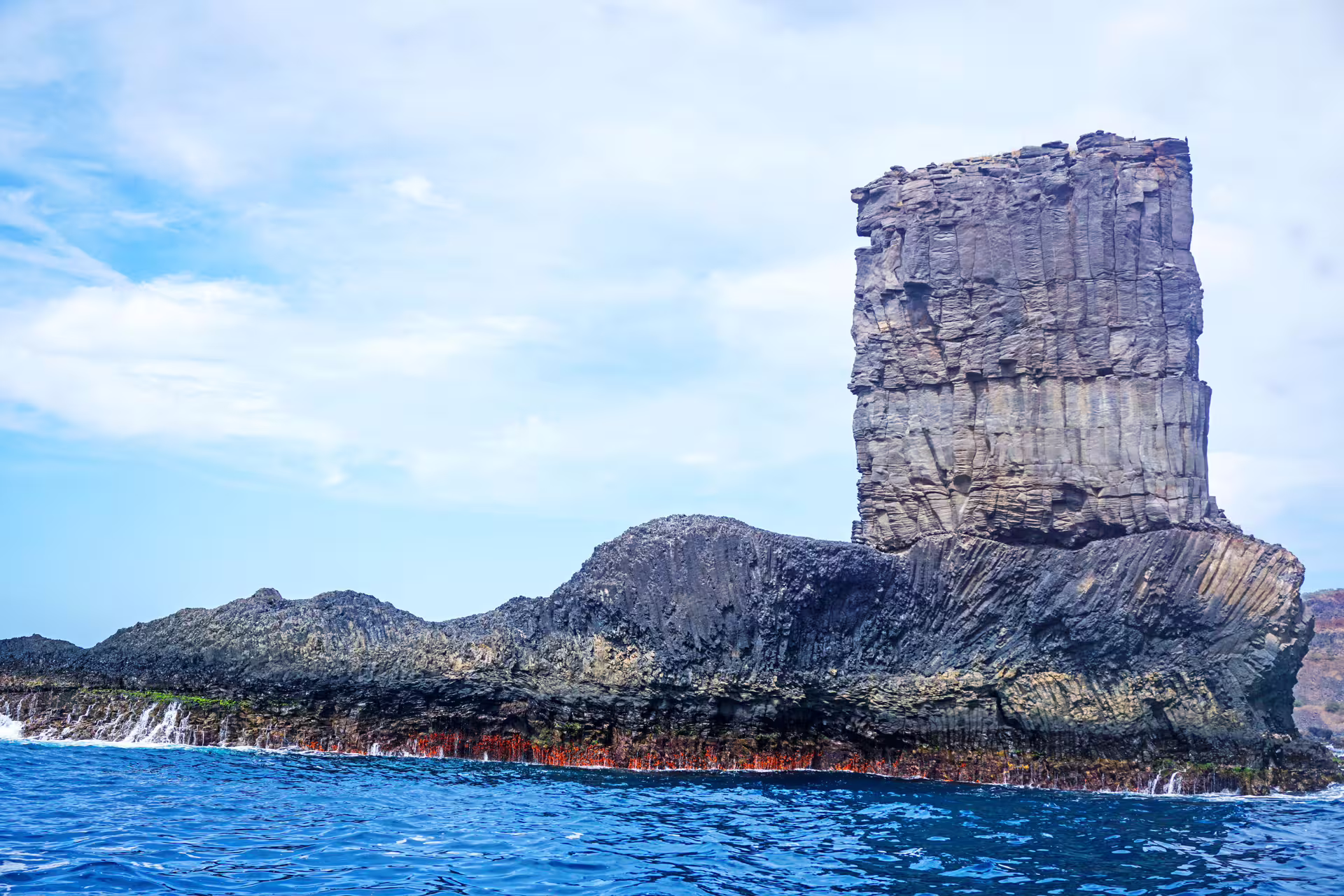 Volcanic sea stack off Ribeira da Barca on Cape Verde boat tour to coastal caves, snorkeling and beach BBQ