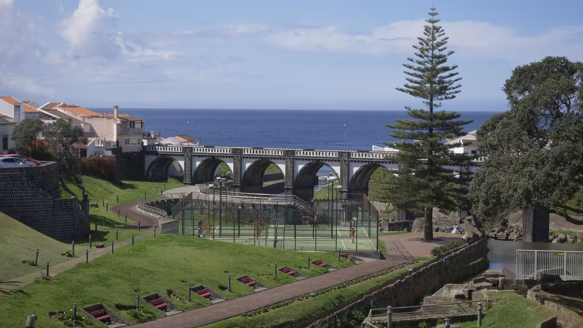 Ribeira Grande scenic viewpoint with arched bridge and Atlantic ocean backdrop on São Miguel city tour