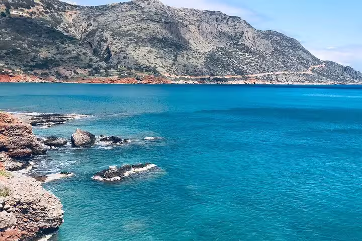 Stunning view of the North Coast's turquoise waters and rugged cliffs on the Richti Waterfall tour.