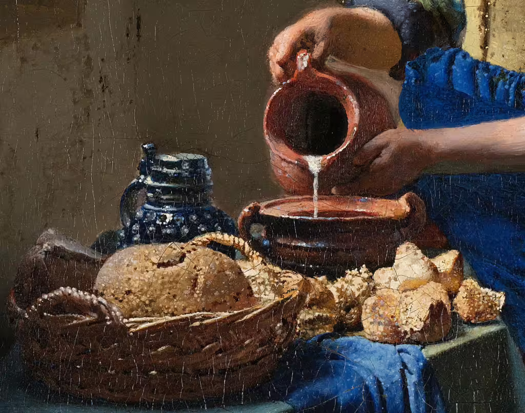 Close-up of a classic Dutch painting at Rijksmuseum featuring detailed bread, pottery, and milk pouring, ideal for private guided tours.