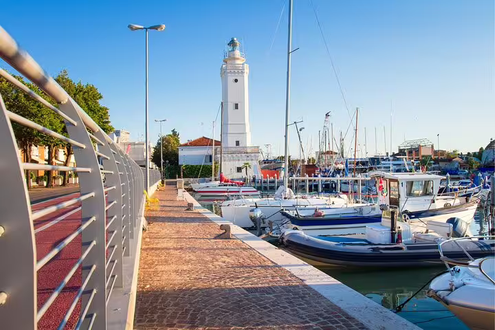 Rimini harbor promenade with lighthouse and boats, scenic highlight on a self-guided scavenger hunt tour