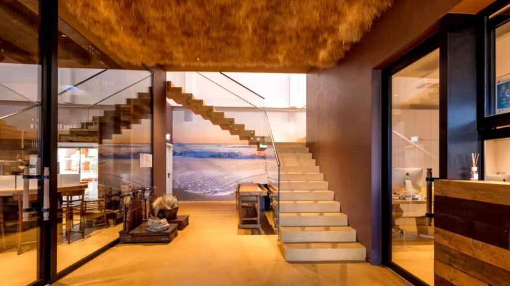 Modern interior entrance and staircase at Rimini: the first Piadina Museum, showcasing Romagna food culture