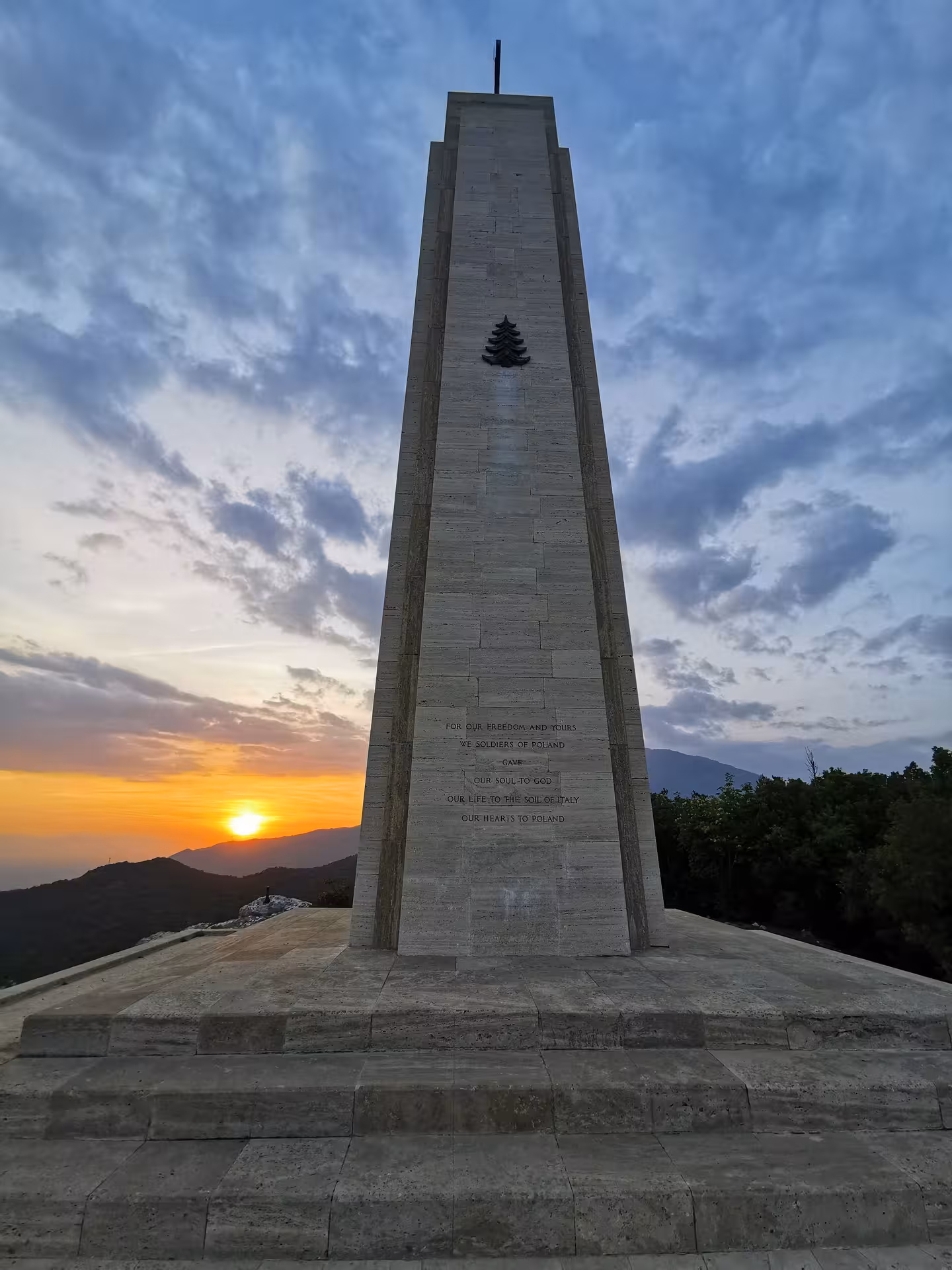 Majestic stone monument at sunset on L'Anello della Collina Imprendibile tour, showcasing stunning views.