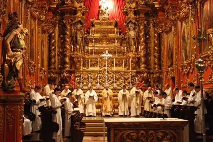 Ornately decorated church interior with clergy in ceremonial robes, highlighting Rio's rich religious heritage.