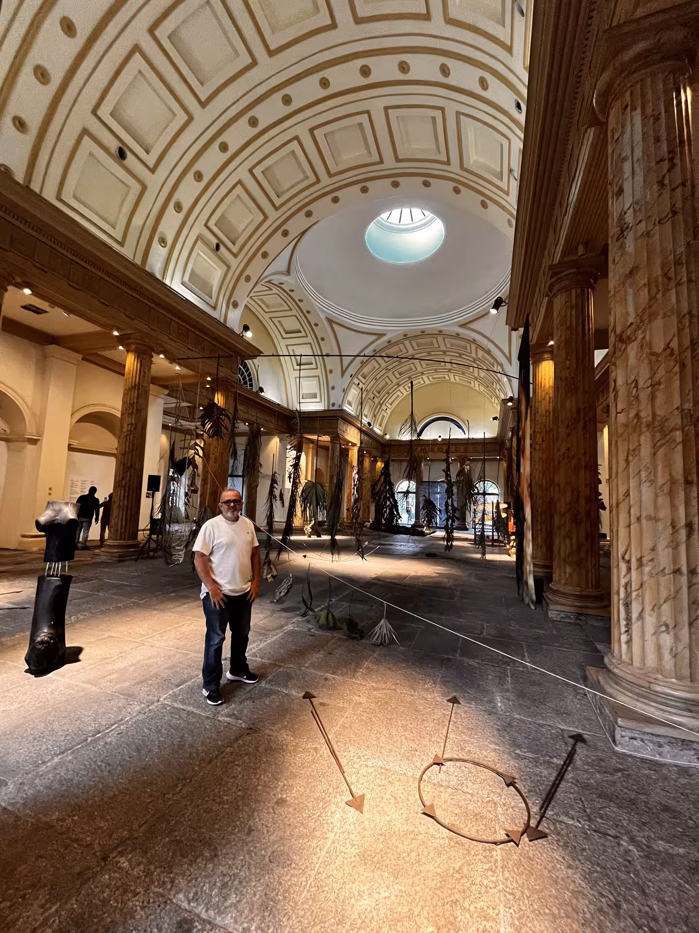 Inside Rio de Janeiro’s historic museum hall with grand arches, a key stop on the city centre pedicab tour
