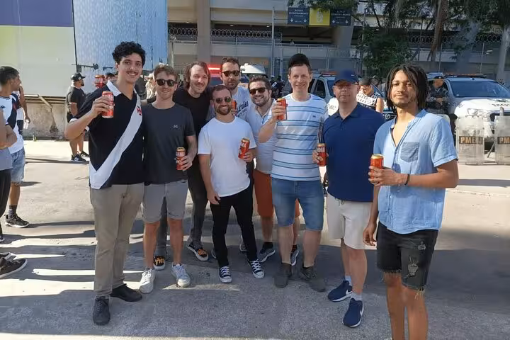 Rio de Janeiro Vasco da Gama matchday meetup with local guide, group of fans holding beers outside stadium