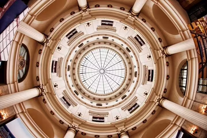 Magnificent domed ceiling of a historic building in Rio, showcasing architectural beauty on the downtown walking tour.