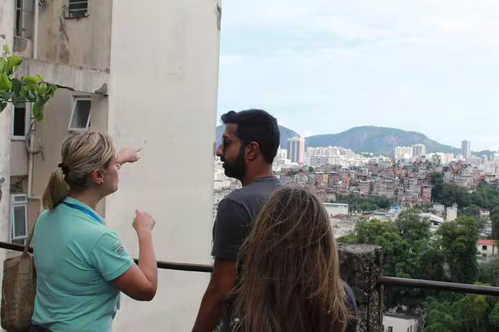 Tourists enjoy panoramic views of Rio de Janeiro from a vantage point, guided on a downtown walking tour.