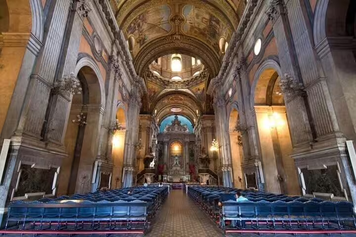 Grandiose church interior with vaulted ceilings and elegant arches, showcasing Rio's historic architecture.