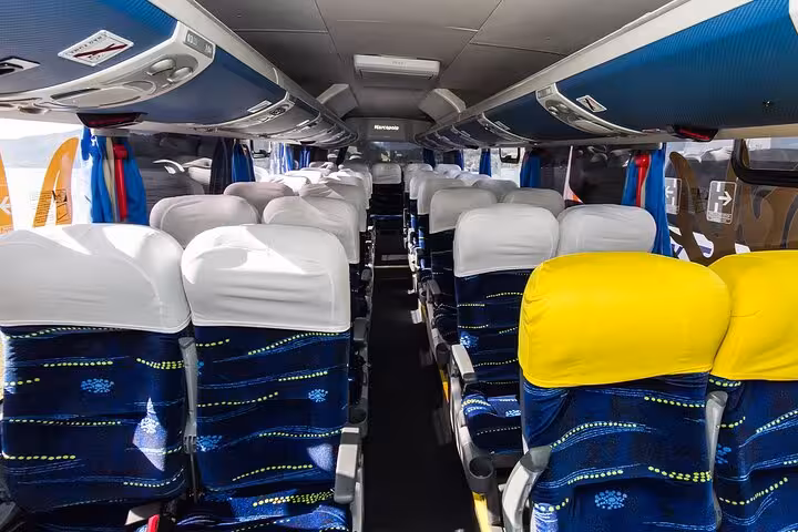 Comfortable interior of a Paraty Tours van with plush seating, providing a relaxing travel experience from Rio to Paraty.