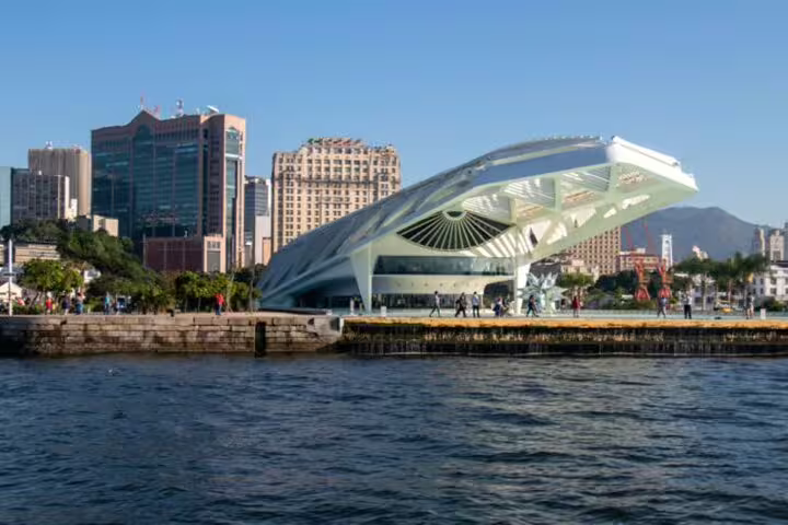 Modern architecture of Rio's Museum of Tomorrow viewed from a private boat tour on the waterfront.