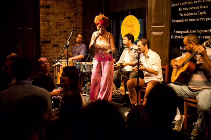 Live samba performance in Rio bar with vibrant crowd enjoying the energetic nightlife and traditional music.